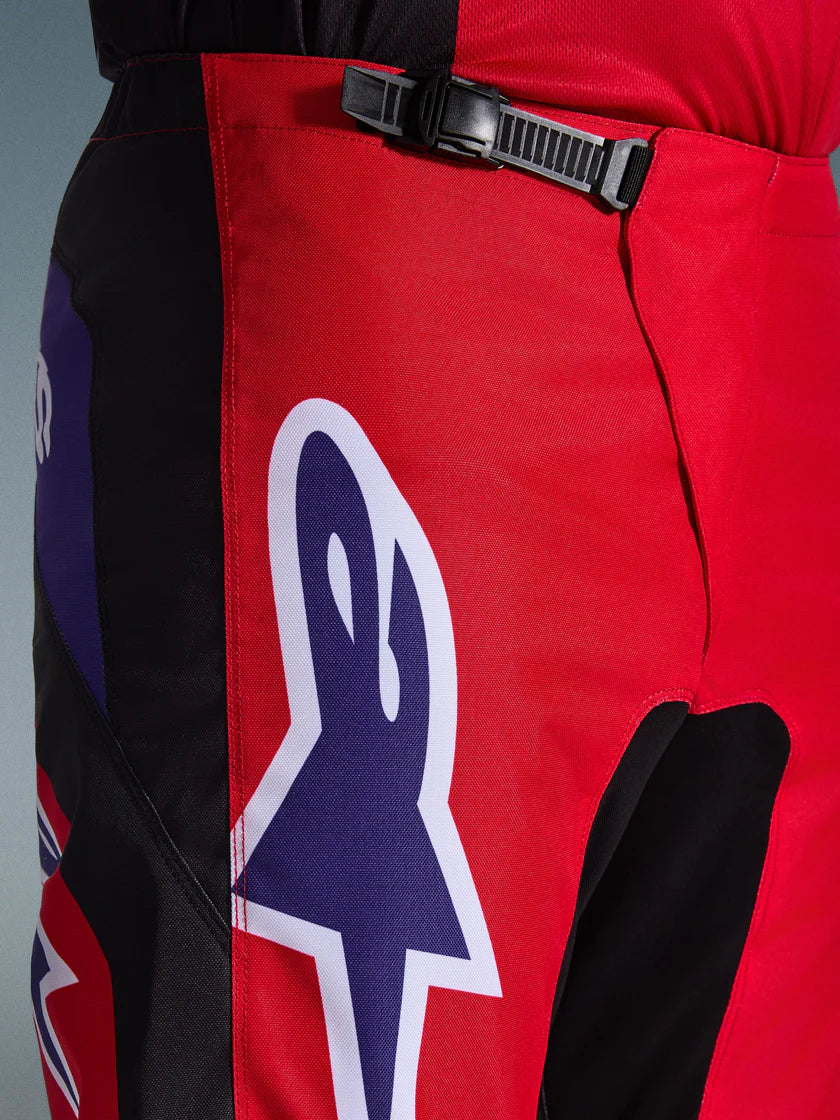 FLUID GRID PANT (Red/Black/Purple) | ALPINESTARS close-up showcasing durable material and sporty design elements.