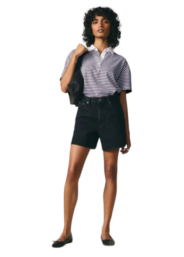 WOMEN'S CINCH MID THIGH SHORT (Open Mind) | LEVI'S model wearing striped polo and baggy denim shorts.