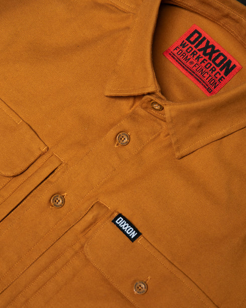 MEN'S LONG SLEEVE WORK SHIRT (Camel) | DIXXON close-up of fabric and label showcasing quality craftsmanship.