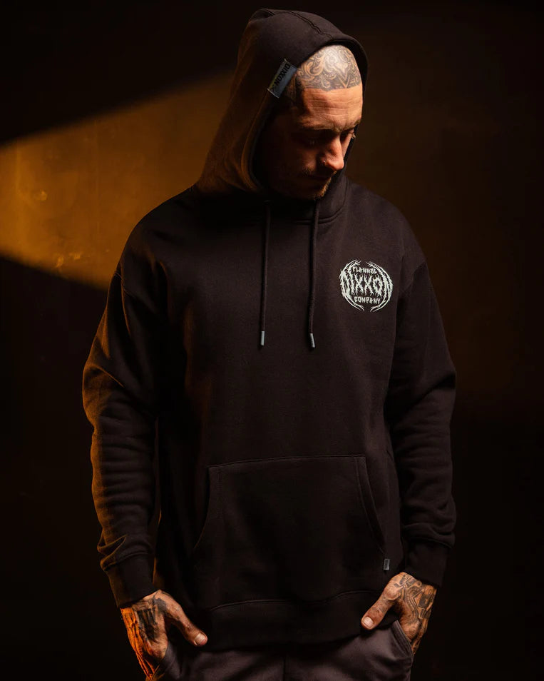 MEN'S WITCHING HOUR HOODIE (Black/Blue) | DIXXON model showcasing style and comfort in a dark setting.