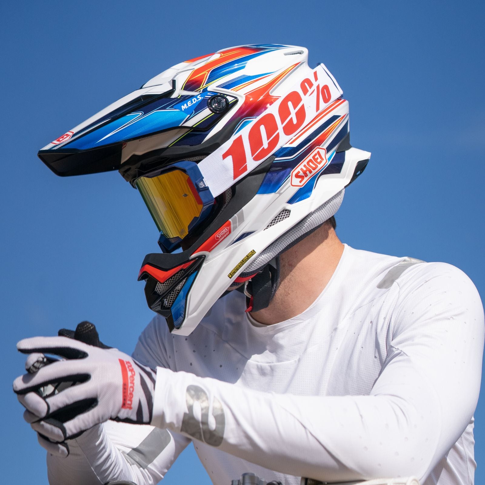 VFX-EVO OFF ROAD HELMET SPARKLE TC-10 | SHOEI worn by rider, showcasing innovative design and vibrant graphics for off-road adventures.
