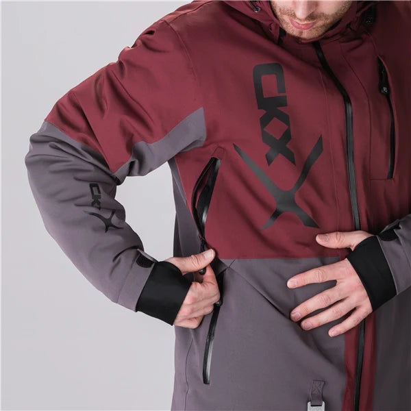 MENS ALASKA JACKET (TAWNY/GREY) | CKX displayed on a model highlighting the zippered pocket and fabric design.