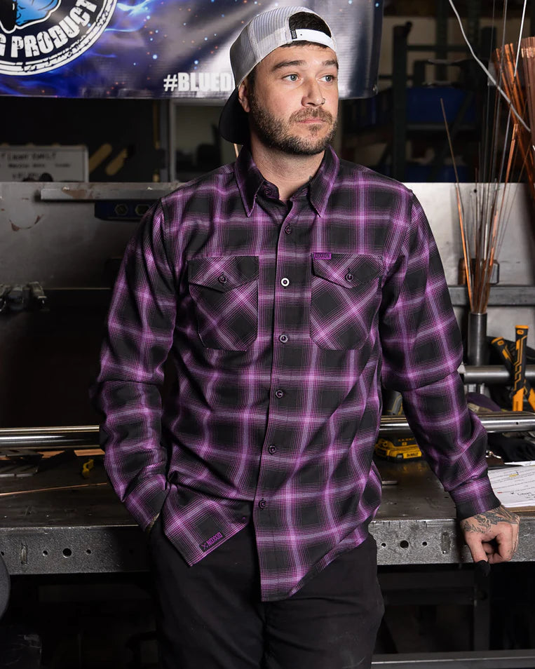 MEN'S ARGON FLANNEL (Purple/Black) | DIXXON model wearing flannel shirt with black and purple plaid pattern, showcasing style and comfort.